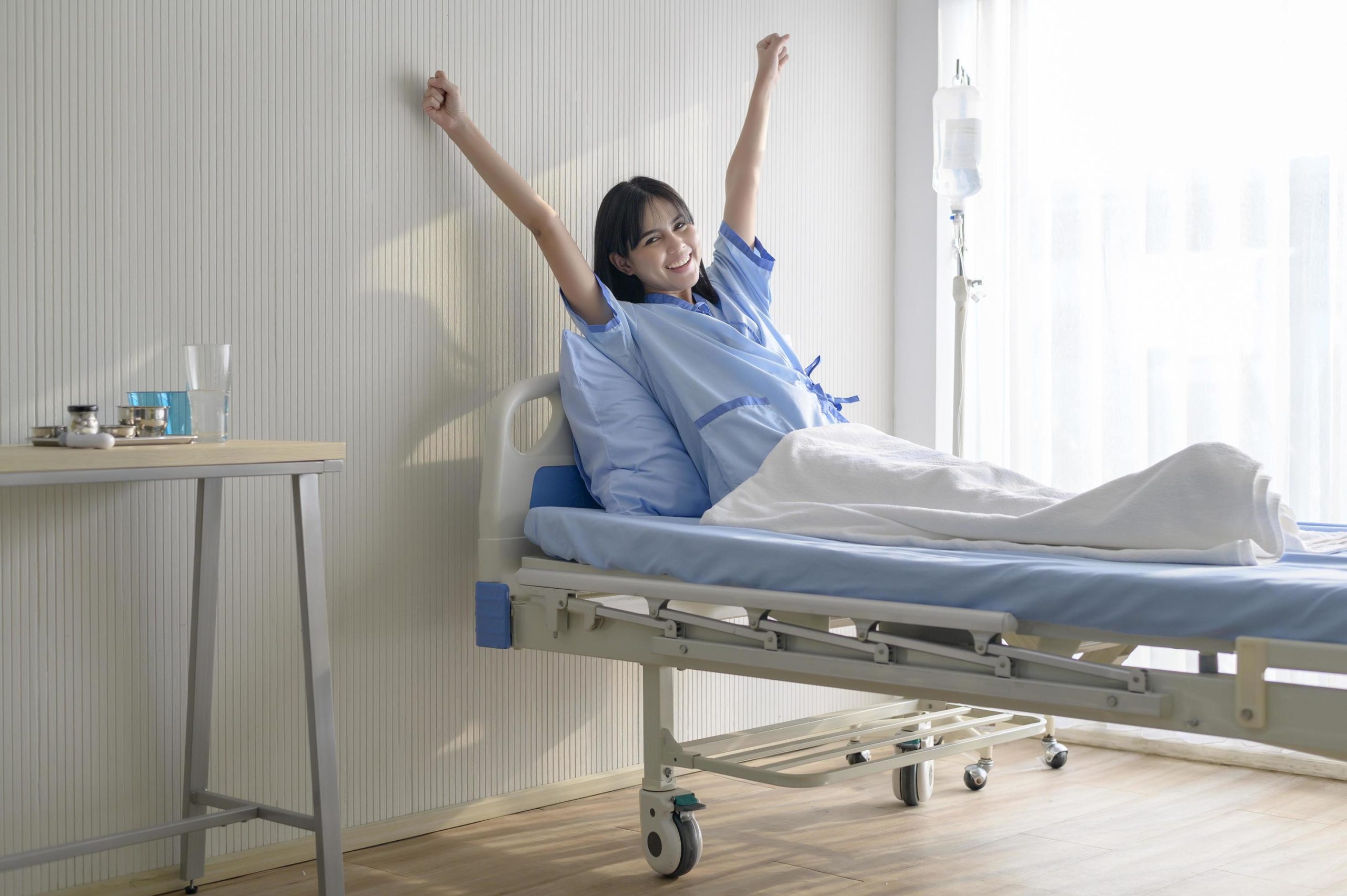 hopeful-and-happy-young-patient-woman-in-hospital-healthcare-and-medical-concept-free-photo