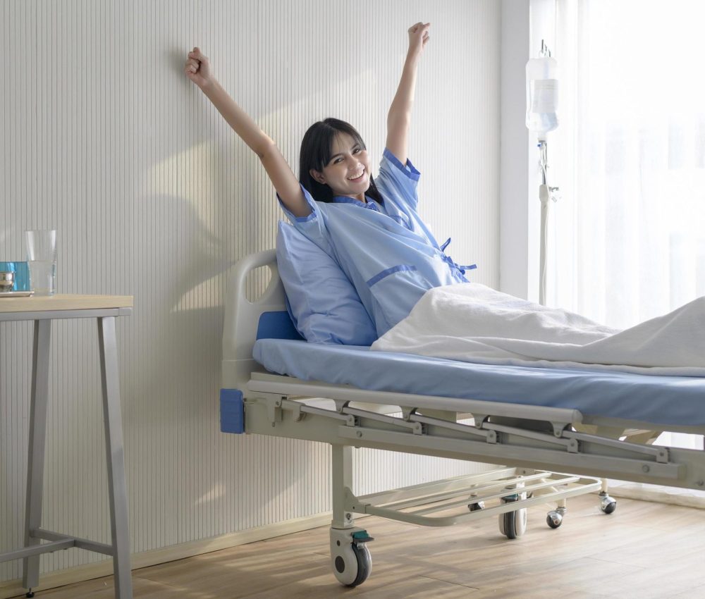 hopeful-and-happy-young-patient-woman-in-hospital-healthcare-and-medical-concept-free-photo